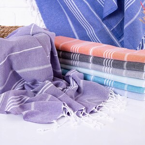 Wedding gift beach towels decorated with my bridesmaids' names on elegant paper wrappers