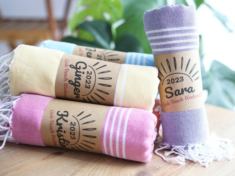 Wedding gift beach towels decorated with my bridesmaids' names on elegant paper wrappers