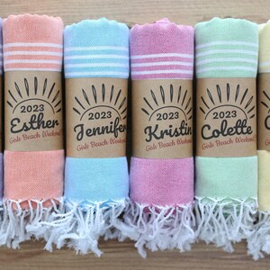 Wedding gift beach towels decorated with my bridesmaids' names on elegant paper wrappers