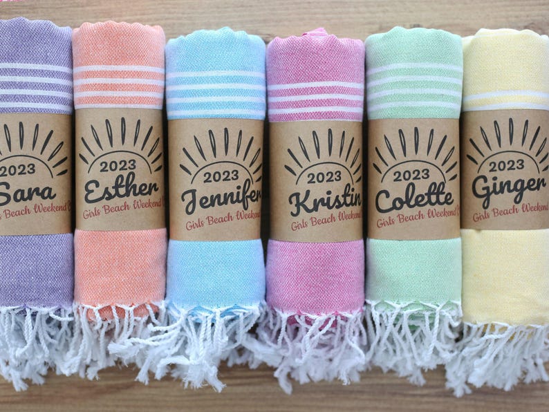 Wedding gift beach towels decorated with my bridesmaids' names on elegant paper wrappers