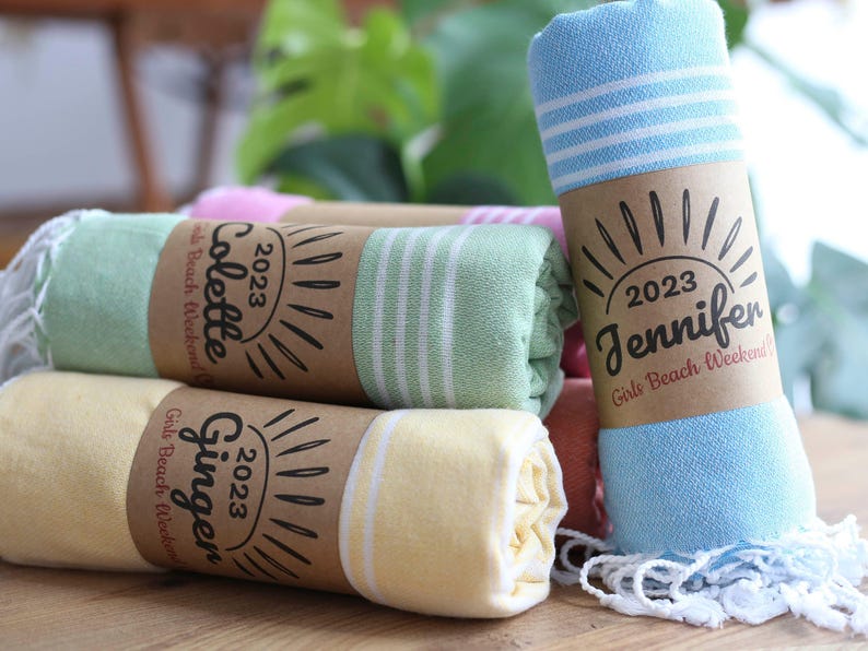 Wedding gift beach towels decorated with my bridesmaids' names on elegant paper wrappers