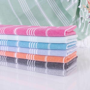 Wedding gift beach towels decorated with my bridesmaids' names on elegant paper wrappers