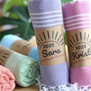 Wedding gift beach towels decorated with my bridesmaids' names on elegant paper wrappers