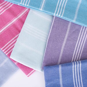 Wedding gift beach towels decorated with my bridesmaids' names on elegant paper wrappers