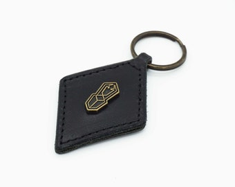 Leather keychain with Beetle logo in Art Deco vintage style