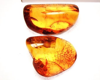 2 x ambre naturel merveilleusement poli, super clair et translucide de 38,5 ct.