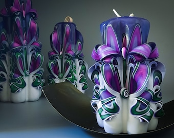 Luxurious purple carved candles in different sizes