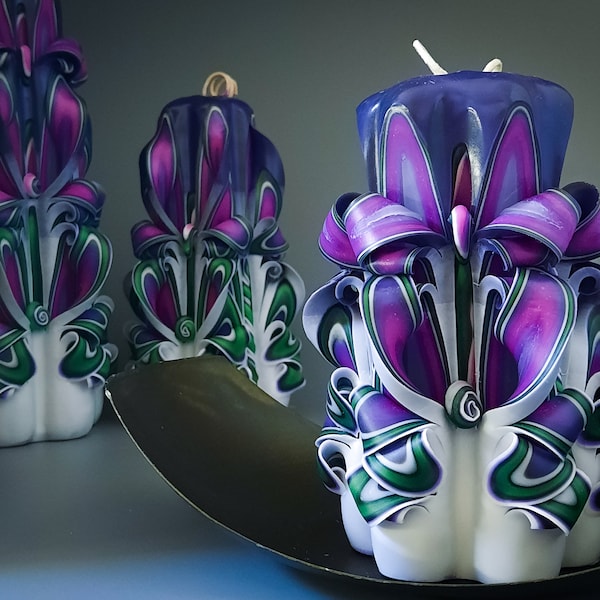 Luxurious purple carved candles in different sizes