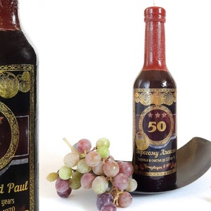 Candle in the shape of a wine bottle. A personalized candle.