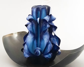 The blue and black carved candle is 5.3 inches tall.