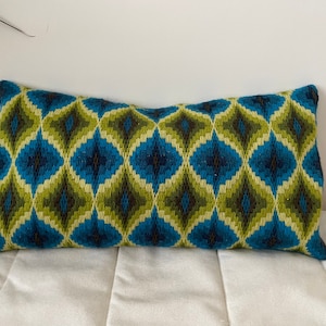 Christmas stocking needlepoint traditional bargello pattern done in teals and white The length is 15 12 and the width at top is 6 12.