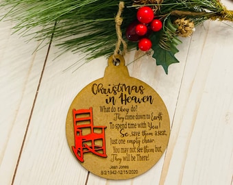 May include: A wooden Christmas ornament with a red rocking chair and the text "Christmas in Heaven. What do they do? They come down to Earth To spend time with You! So save them a seat, Just one empty chair. You may not see them but, They will be There! Jean Jones 8/2/1942-12/15/2020"