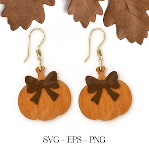 May include: A pair of wooden pumpkin earrings with brown bow accents. The earrings have gold-colored ear wires and are set against a white background with brown leaf accents. The text "SVG - EPS - PNG" is at the bottom.