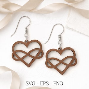 May include: A pair of wooden earrings featuring a heart and infinity symbol design. The earrings are brown with silver-colored ear wires. The image includes the text "SVG - EPS - PNG".
