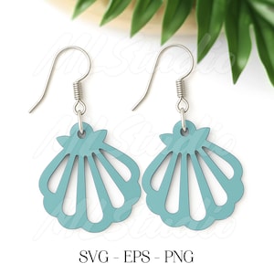 以下が含まれることがあります： 銀色のフックが付いた、ターコイズ色の貝殻型のイヤリングのペア。 イヤリングはスカラップエッジと扇のようなデザインです。 画像には「SVG - EPS - PNG」というテキストも含まれています。