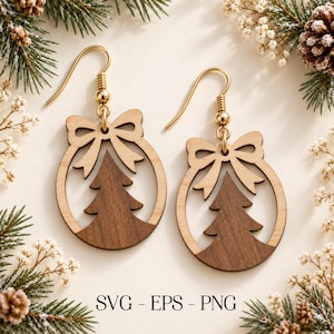 May include: A pair of wooden dangle earrings featuring a circular frame with a cutout Christmas tree design and a bow at the top. The earrings are suspended from gold-toned metal hooks. The text SVG - EPS - PNG is printed at the bottom.