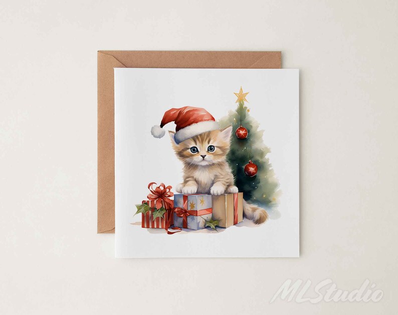 May include: A Christmas card featuring a cute kitten wearing a Santa hat and sitting on a stack of presents in front of a Christmas tree.