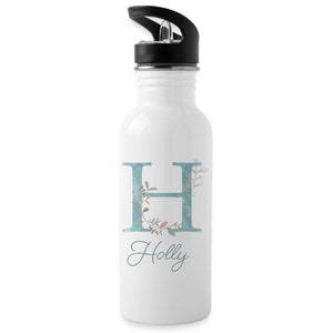 May include: White stainless steel water bottle with a black lid and a teal blue floral design featuring the letter H and the name Holly.