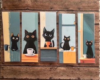 May include: Set of five black cat bookmarks with different poses and expressions. Each bookmark features a black cat holding a cup of coffee or tea. The bookmarks are printed on a white background with a blue and white window design.