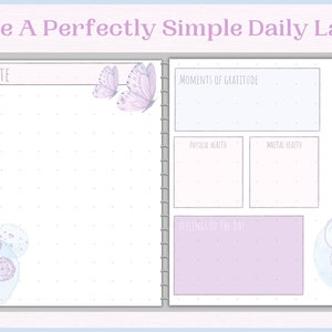 May include: A printable daily planner page with a light blue and purple colour scheme. The page includes sections for "Date", "Moments of Gratitude", "Physical Health", "Mental Health", "Feelings of the Day", and "Release Heavy Feelings Daily".