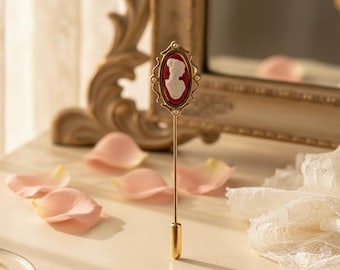 Elegant Victorian Style 1970’s Avon Gold Tone Hat Stick Pin w/Raised Cameo Design on Coral Pink Background/Collectible Pins/Cameo Jewelry