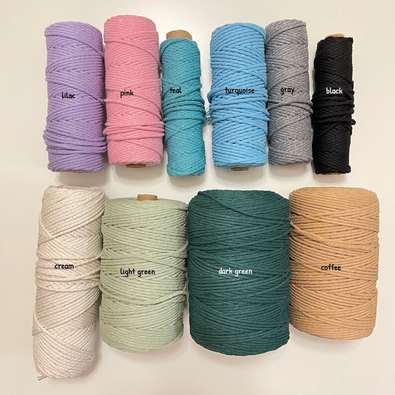 May include: Assortment of 10 spools of cotton rope in various colors, including lilac, pink, teal, turquoise, gray, black, cream, light green, dark green, and coffee.
