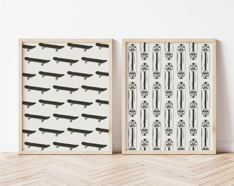 May include: Two framed prints with black and white skateboard patterns. The print on the left has a pattern of skateboards in a diagonal line. The print on the right has a pattern of skateboards in a vertical line.