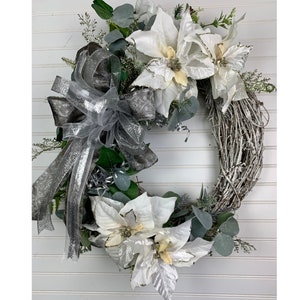 White and Silver Flocked Christmas Wreath, Flocked Grapevine Base with White Poinsettias, Iced Greenery, Silver Berries & Holiday Ribbon