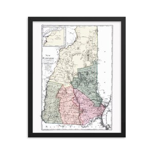May include: A vintage map of New Hampshire, showing the state's counties and towns. The map is printed in black and white with colored borders for each county. The map is framed in black.