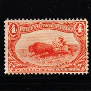 May include: A vintage four-cent postage stamp featuring a red illustration of a bison being hunted by Native Americans. The stamp is framed by a decorative border with the text "United States of America" and "Four Cents".