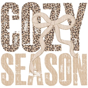 May include: A graphic design featuring the words "COZY SEASON" in a mix of fonts and textures. The word "COZY" has a leopard print pattern, while "SEASON" is in a tan, distressed style. A beige ribbon bow is centered above the word "SEASON".