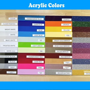 May include: A display of acrylic color samples, including clear, white, blue, orange, and glitter finishes. Each color is labeled with its name, such as "Transparent Blue" and "Bright Gold Mirror". The image is titled "Acrylic Colors".