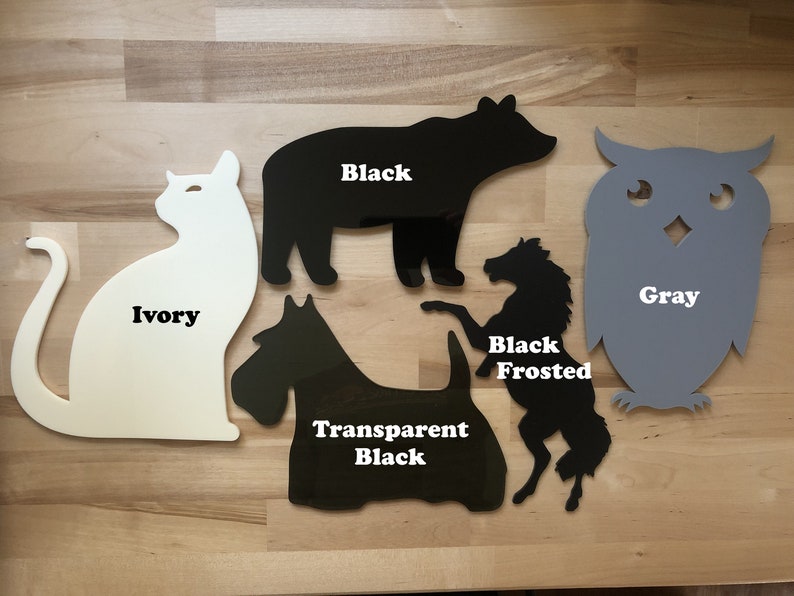 May include: Assortment of animal-shaped cutouts in various colors. Includes an ivory cat, a black bear, a gray owl, a black frosted horse, and a transparent black dog. Each cutout has the color name printed on it.