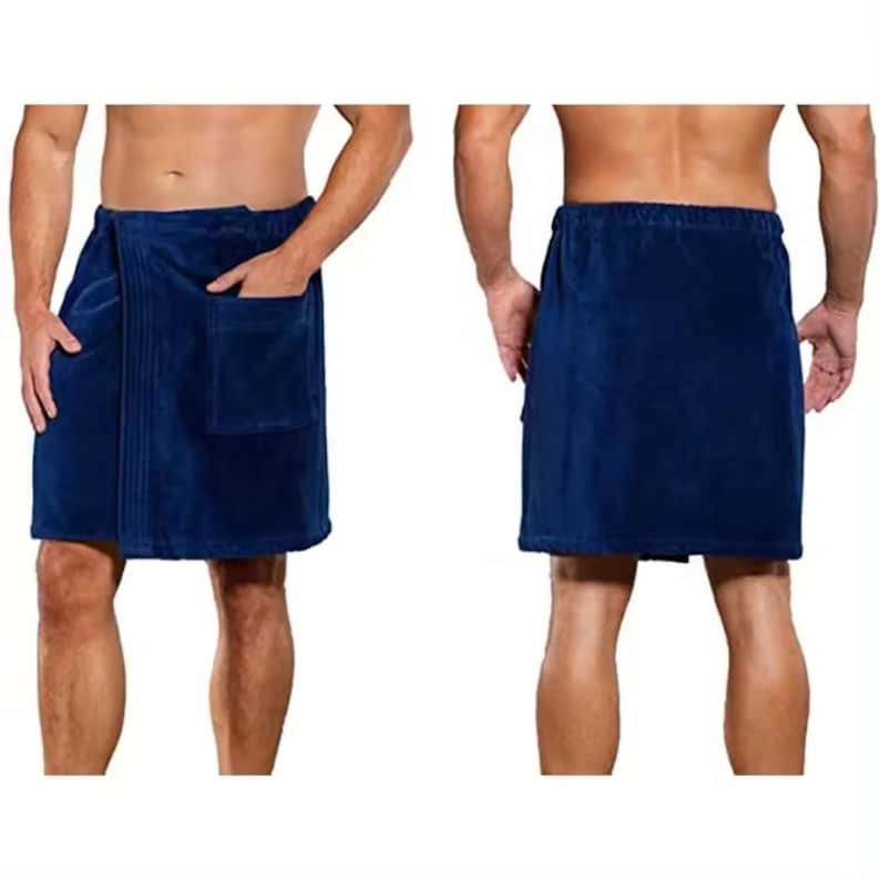May include: A navy blue wrap-around towel with a pocket on the side. The towel is made of soft, absorbent material and is perfect for drying off after a shower or bath.