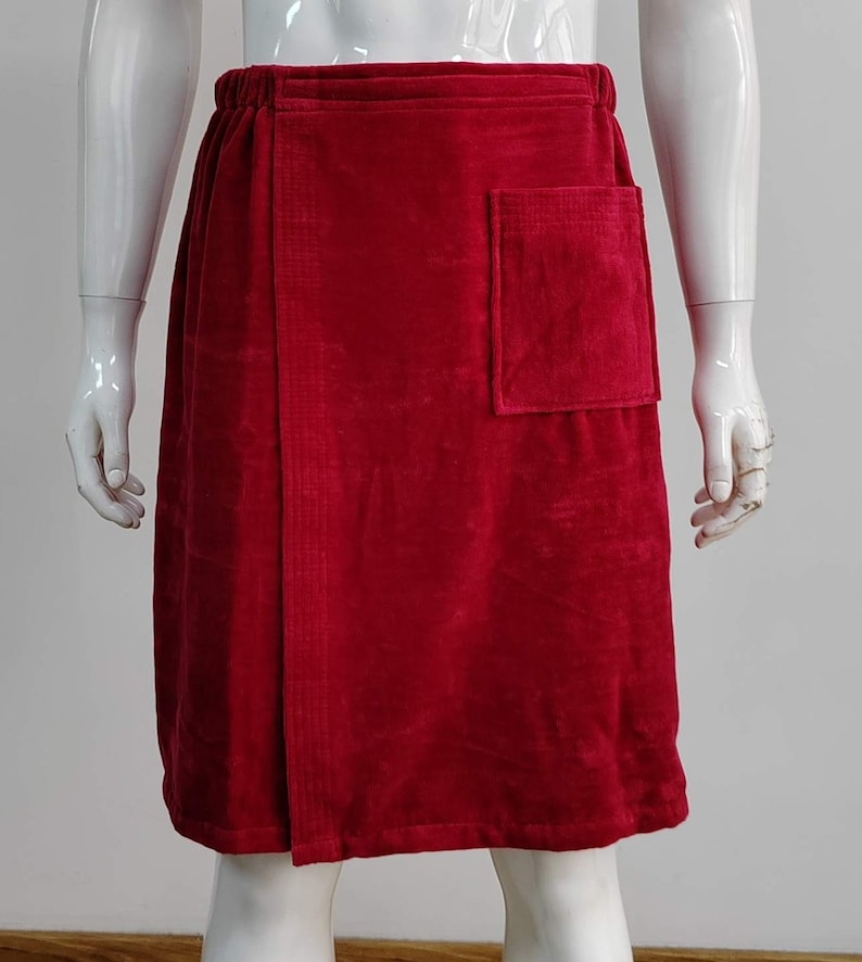 May include: A red terry cloth wrap skirt with a single pocket on the right side.