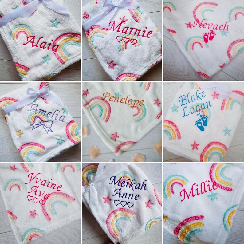 May include: Nine personalized rainbow blankets with embroidered names, including Alaia, Marnie, Penelope, Amelia, Nevaeh, Blake Logan, Yvaine Ava, Meikah Anne, and Millie. The blankets are white with a rainbow design and stars.
