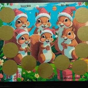 May include: A Christmas-themed scratch-off card featuring cartoon squirrels wearing Santa hats. The card has several gold scratch-off circles and the text "Save $56" and "$2-$8". The background includes presents and a blue sky.