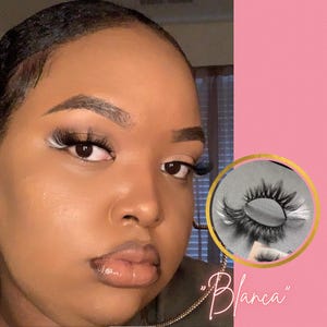 May include: A close-up of a person's face with dramatic eye makeup and long eyelashes. The image also includes a close-up of a pair of false eyelashes labeled "Blanca".
