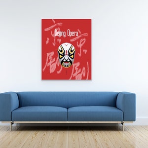 May include: A red canvas print featuring a stylized Beijing Opera mask with white, yellow, and black details. The words "Beijing Opera" and Chinese characters are written on the canvas. The print hangs above a blue sofa.