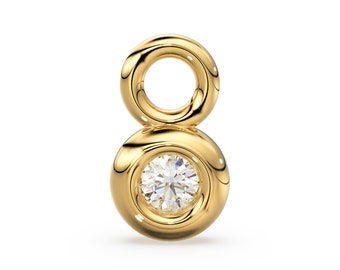 May include: Gold charm with a small round diamond in the center and a loop at the top.