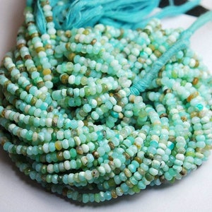 May include: A strand of turquoise and green opal beads. The beads are faceted and have a slightly irregular shape. The strand is approximately 40 cm long and is perfect for making jewellery.