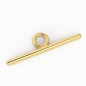 May include: Gold-toned metal toggle clasp with a round loop. This clasp is used for jewelry making.