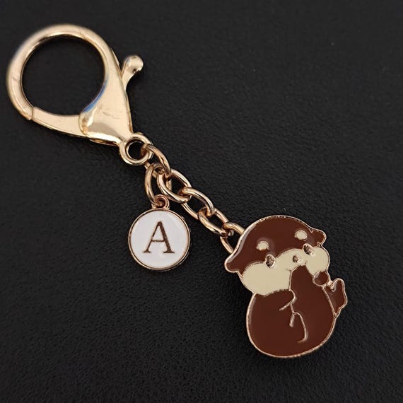 Porta chiavi Charm con nappa e anello Caramel Pelle Martellata Oro