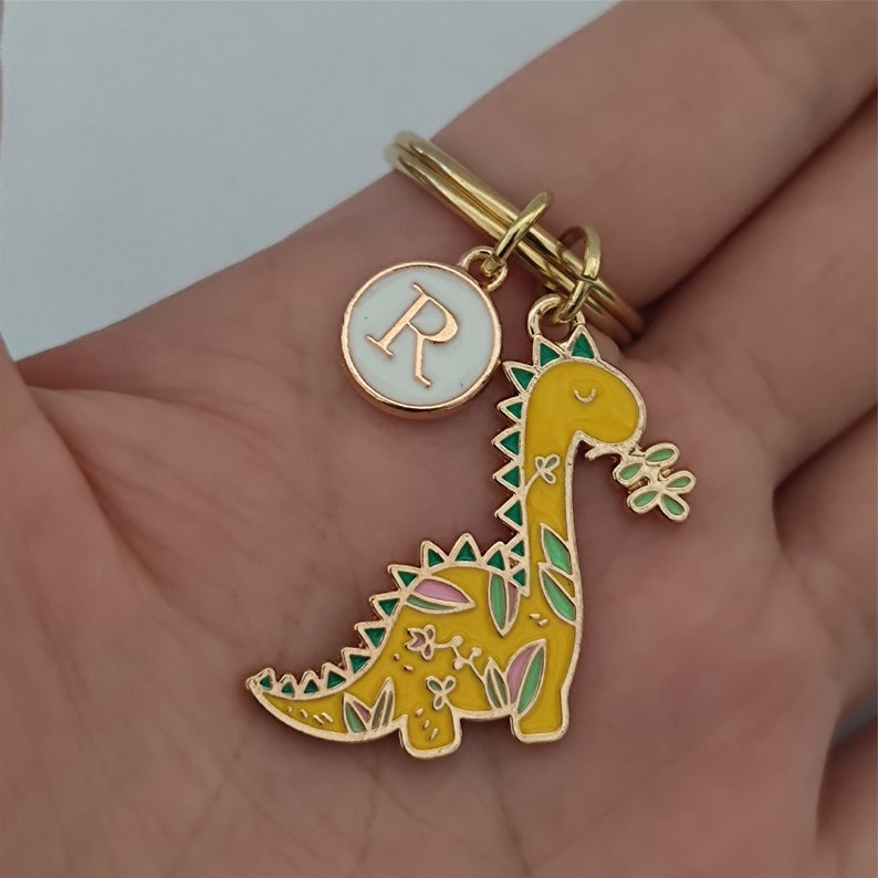 Yellow dinosaur keychain in use