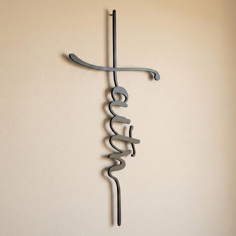 a metal cross-shaped decoration hanging on a wall.