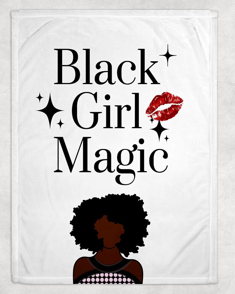May include: White blanket with the words "Black Girl Magic" in black font, accompanied by a red lip print, and a silhouette of a Black woman. The design includes star accents.