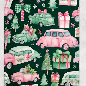 May include: A dark green blanket featuring a repeating pattern of pink and green vintage cars, Christmas trees, gift boxes, and snowflakes. The cars have bows and holly. The gift boxes are wrapped with bows. A festive holiday design.