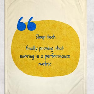 May include: A cream-colored blanket with a large yellow circle and blue quotation marks. The text within the circle reads "Sleep tech finally proving that snoring is a performance metric."