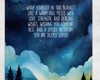 May include: A blue and white watercolor illustration of a starry night sky with mountains and trees. The text reads: "Wrap yourself in this blanket like a warm hug, filled with love, strength, and healing wishes. Wishing you comfort, rest, and a speedy recovery. You are deeply loved!"
