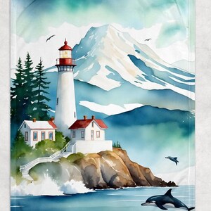 May include: A watercolor-style blanket featuring a coastal scene. A white lighthouse with a red top stands on a rocky cliff, with two small houses nearby. The ocean has two dolphins jumping. Mountains and trees are in the background.